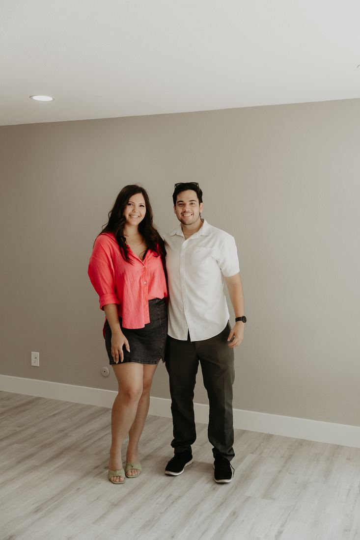 Couple in their new living room on closing day