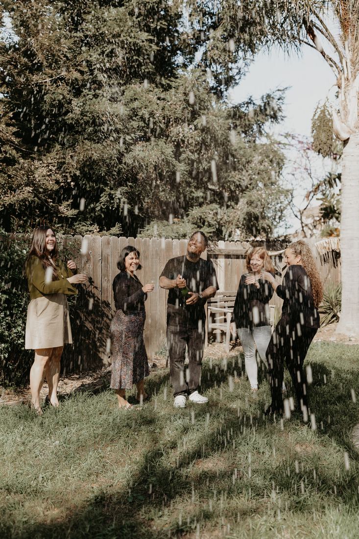 Family in the backyard of their new home