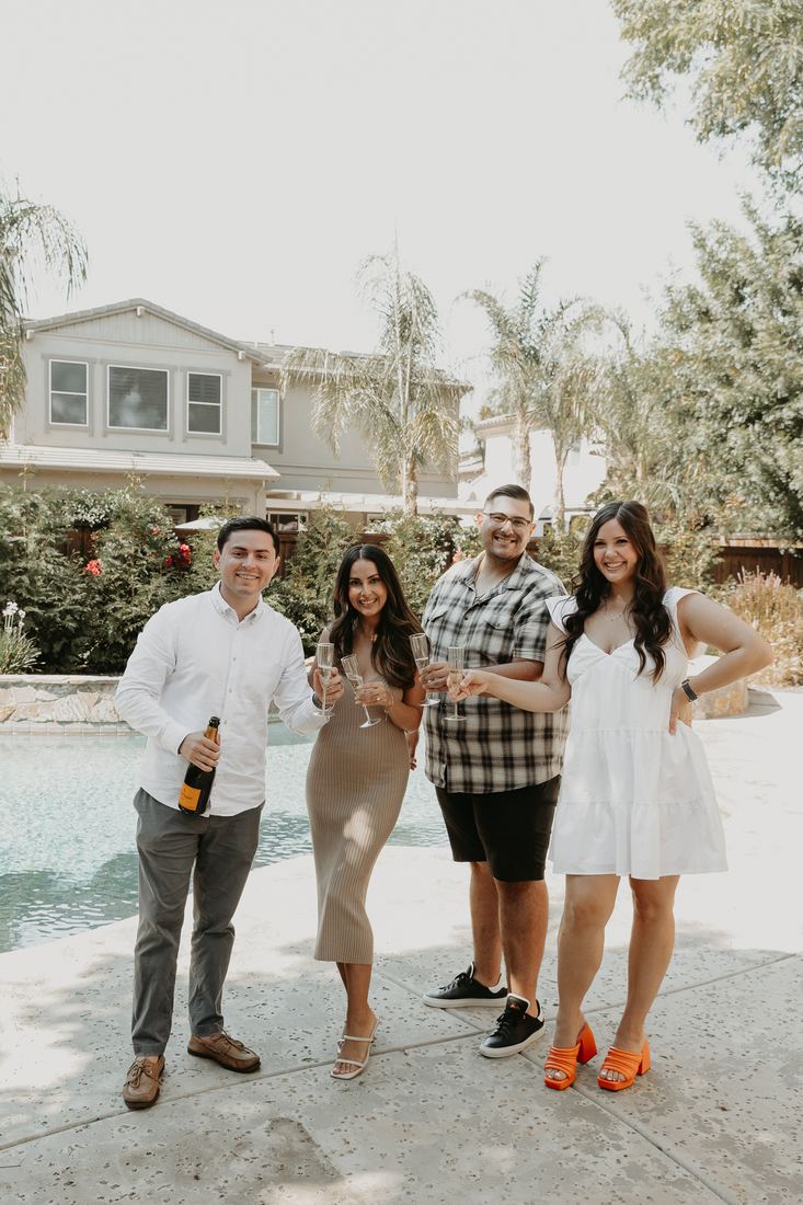 Family in front of their new home