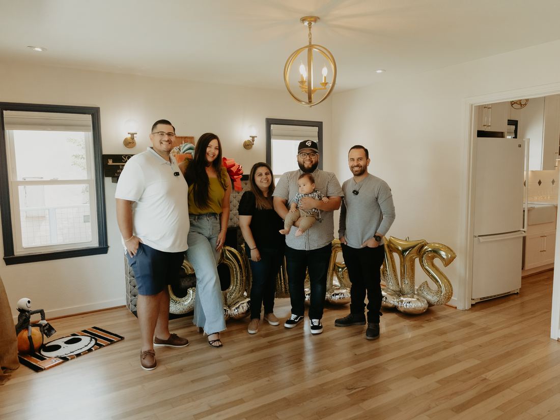 Family celebrating inside their new home