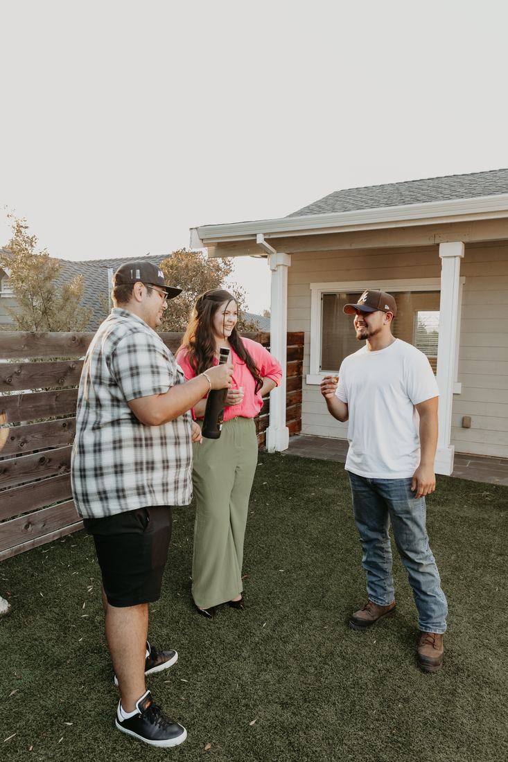 Family in the yard of their new home