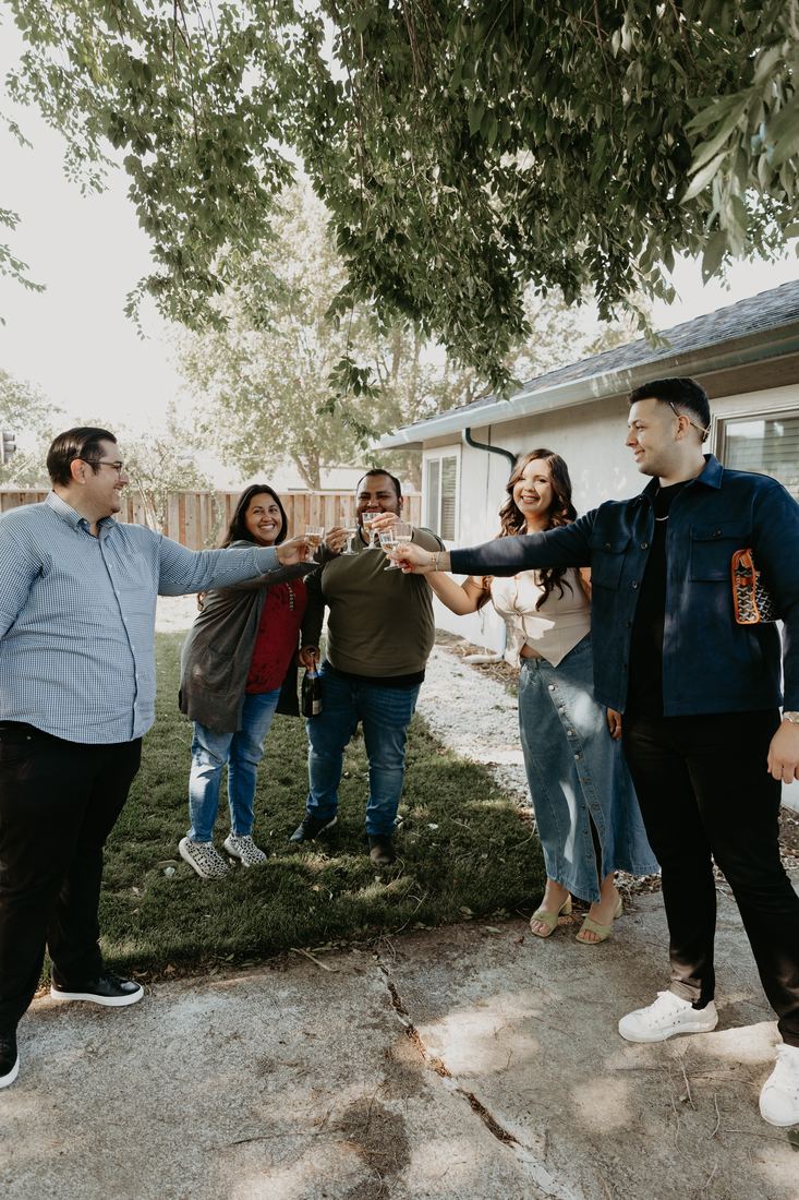 Family celebrating in the backyard on closing day