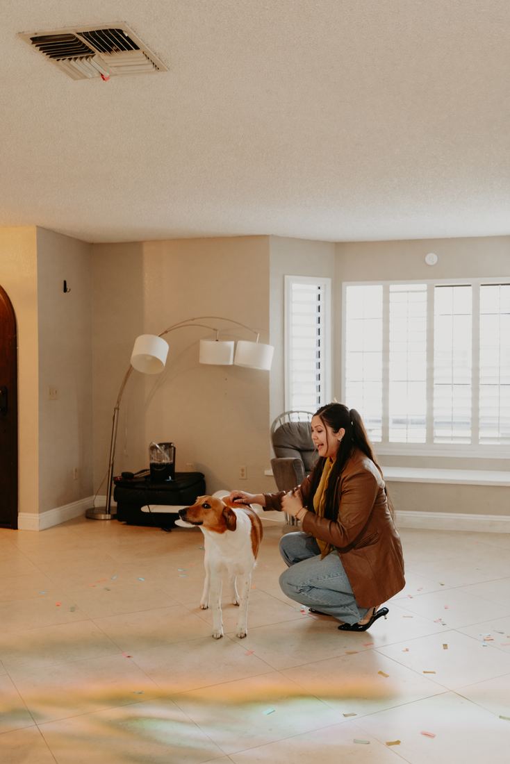 Buyer sitting in her empty new home