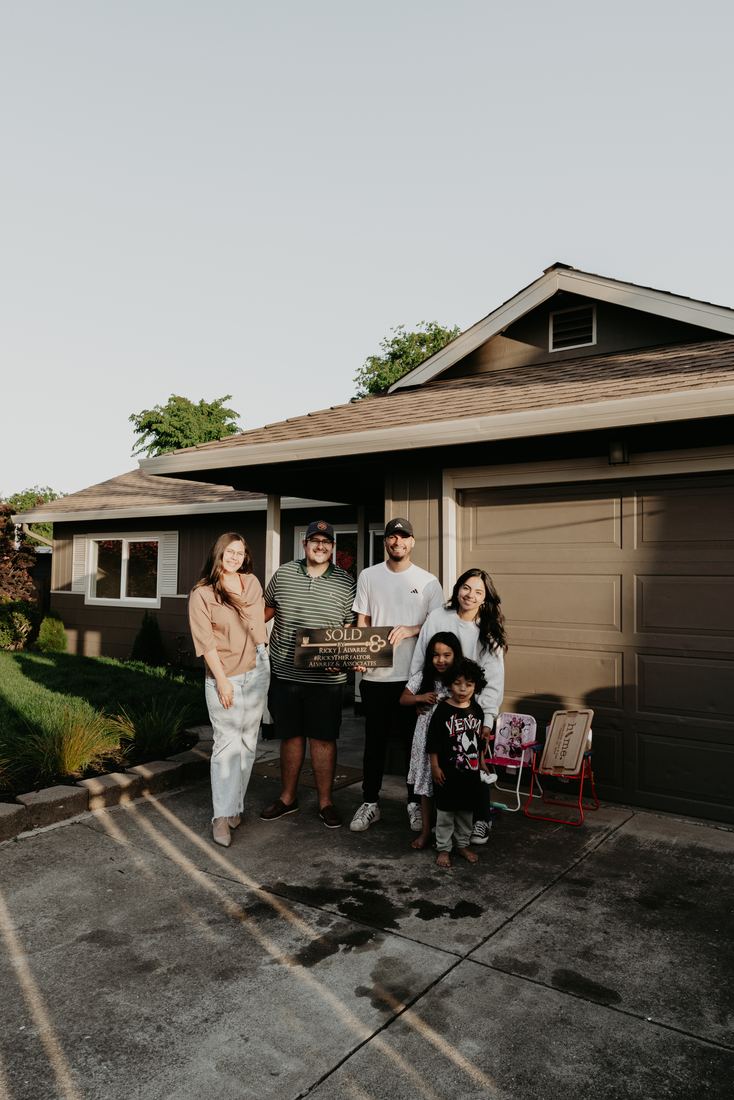 Family with keys in hand on closing day