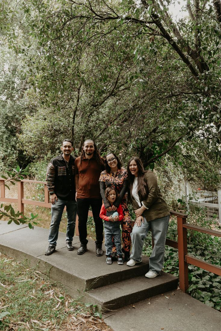 Family on the front steps of their new home