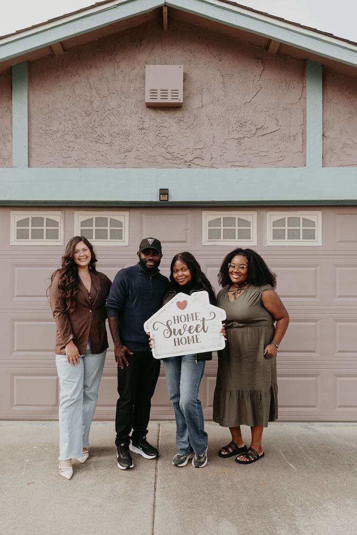 Family with a Home Sweet Home sign