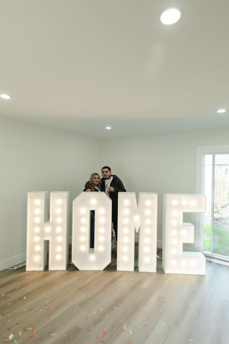 HOME letters in an empty new living room